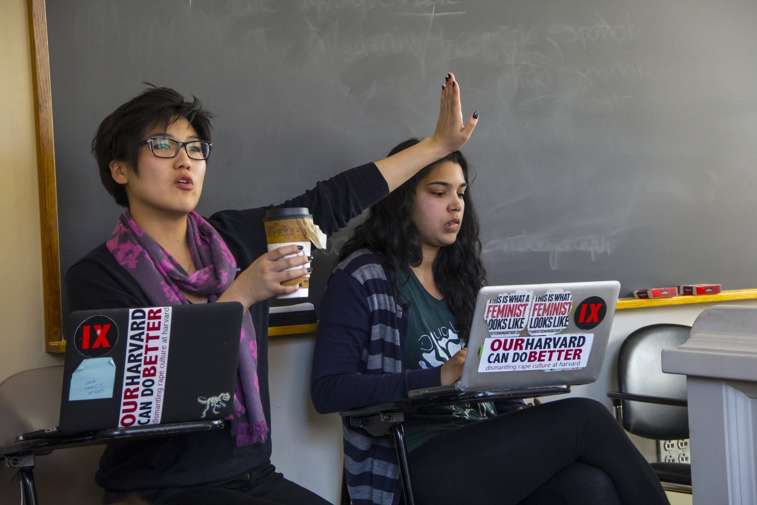 Kate Sim ‘14, left, and Pearl Bhatnagar ‘14, right, with other members of the group Our Harvard Can Do Better discuss Title IX and its implementation at Harvard in April. 