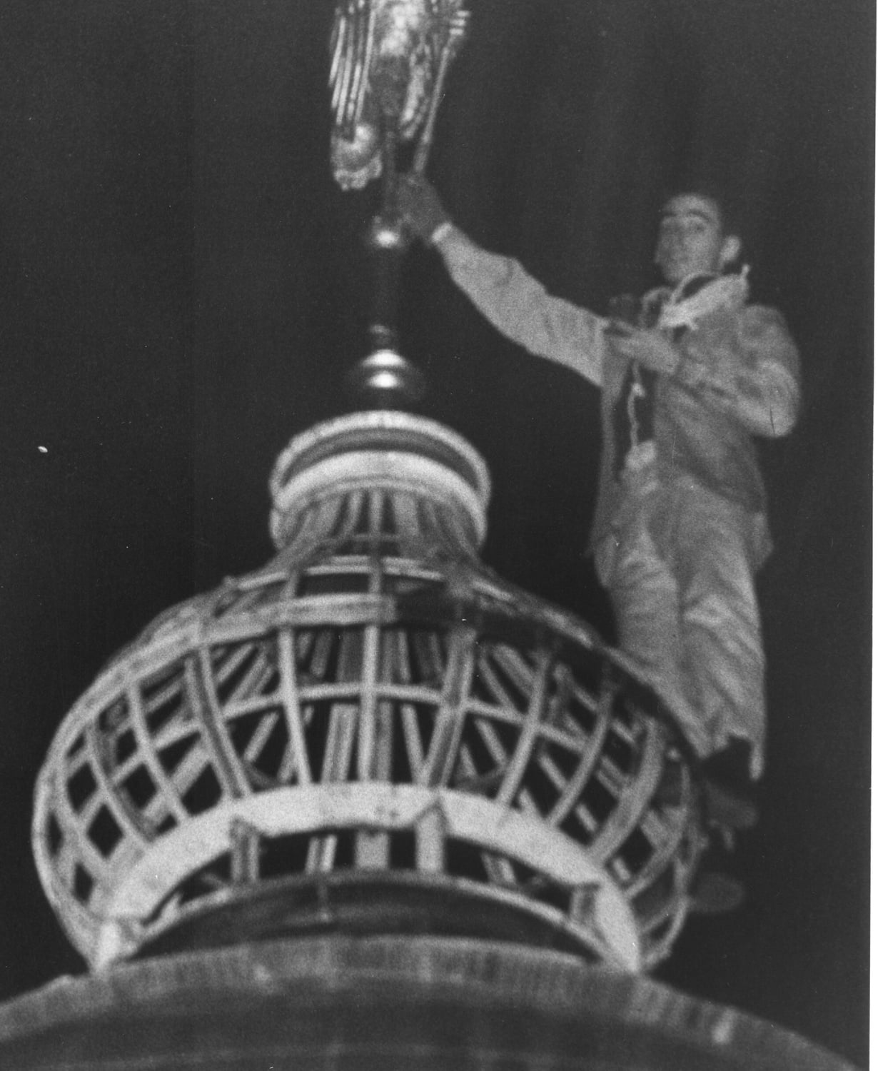 David Royce ’56 stands atop the Lampoon Castle ready to claim the organization’s treasured ibis.