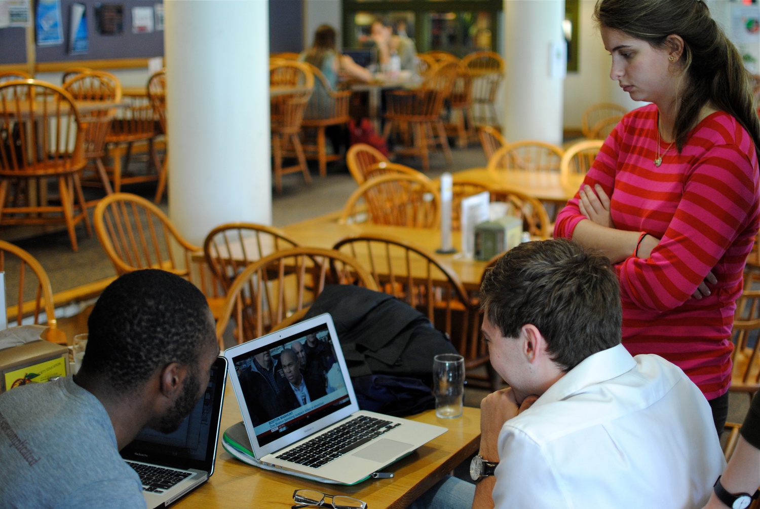 Robert N. Hawthorne ‘15, Ewan H. Foster ‘15, and Caroline R.Brenin ‘15 watch from lock down in Cabot as Governor Deval Patrick gives a statement early Friday morning.