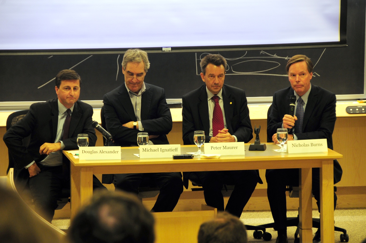 Peter Maurer, right, Douglas Alexander, left, and Michael Ignatieff, center, discuss the current situation in Syria and the Middle East. The panel was moderated by Nicholas Burns.