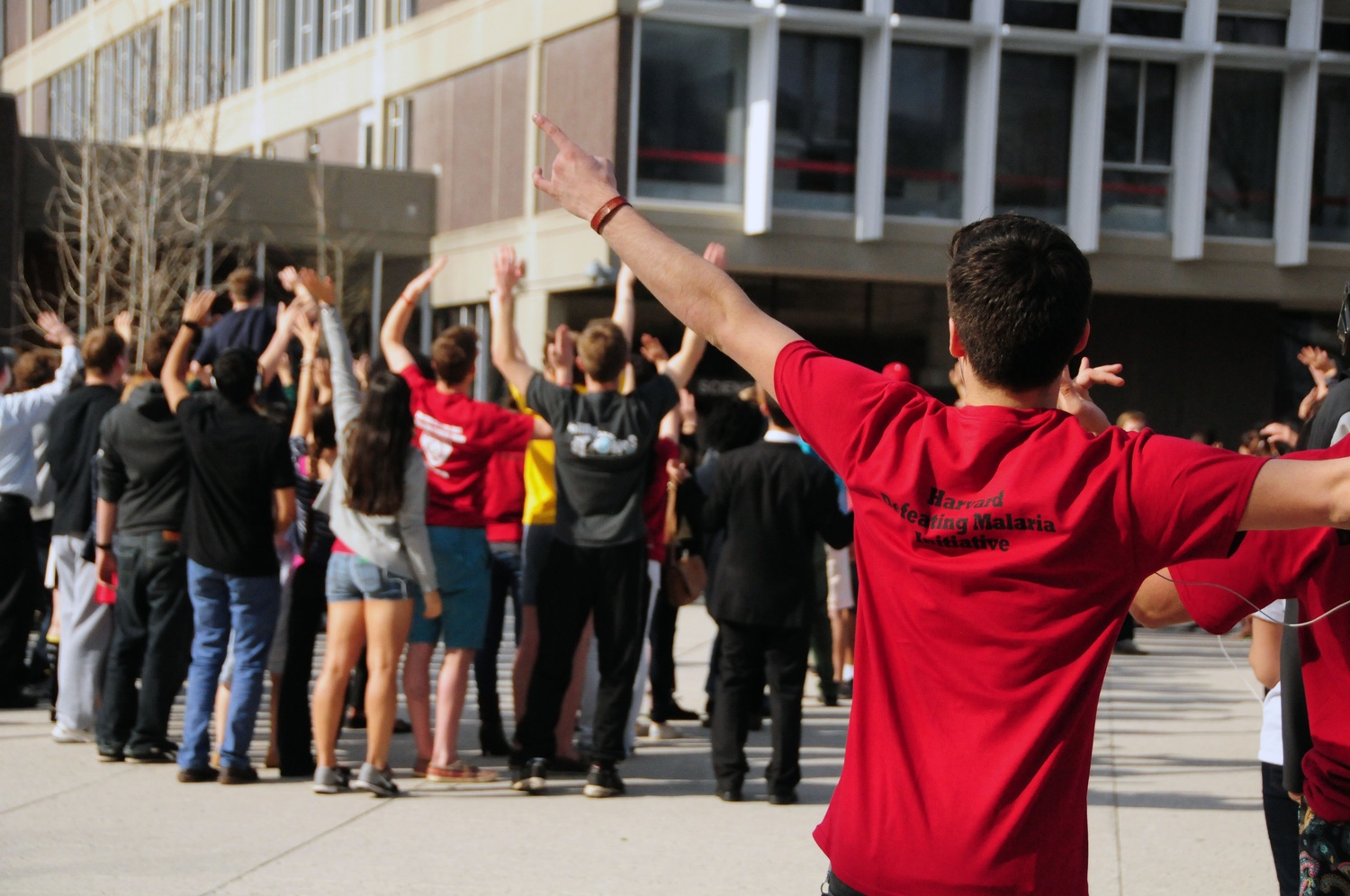 Students take part in a flash mob as part of Mob Malaria on World Malaria Day.