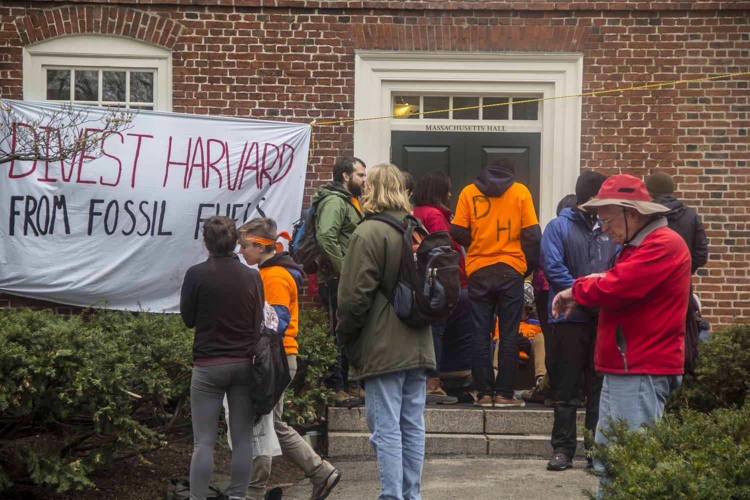 Divest Harvard activists blockaded one of the entrances in front of Massachusetts Hall to protest against the University's continued investment in various fossil fuel companies.