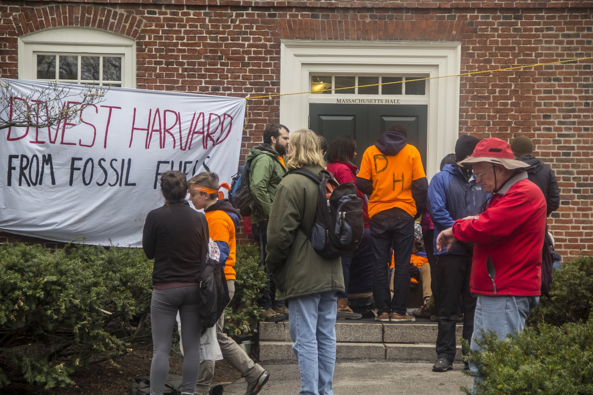 Divest Harvard activists blockaded one of the entrances in front of Massachusetts Hall to protest against the University's continued investment in various fossil fuel companies.