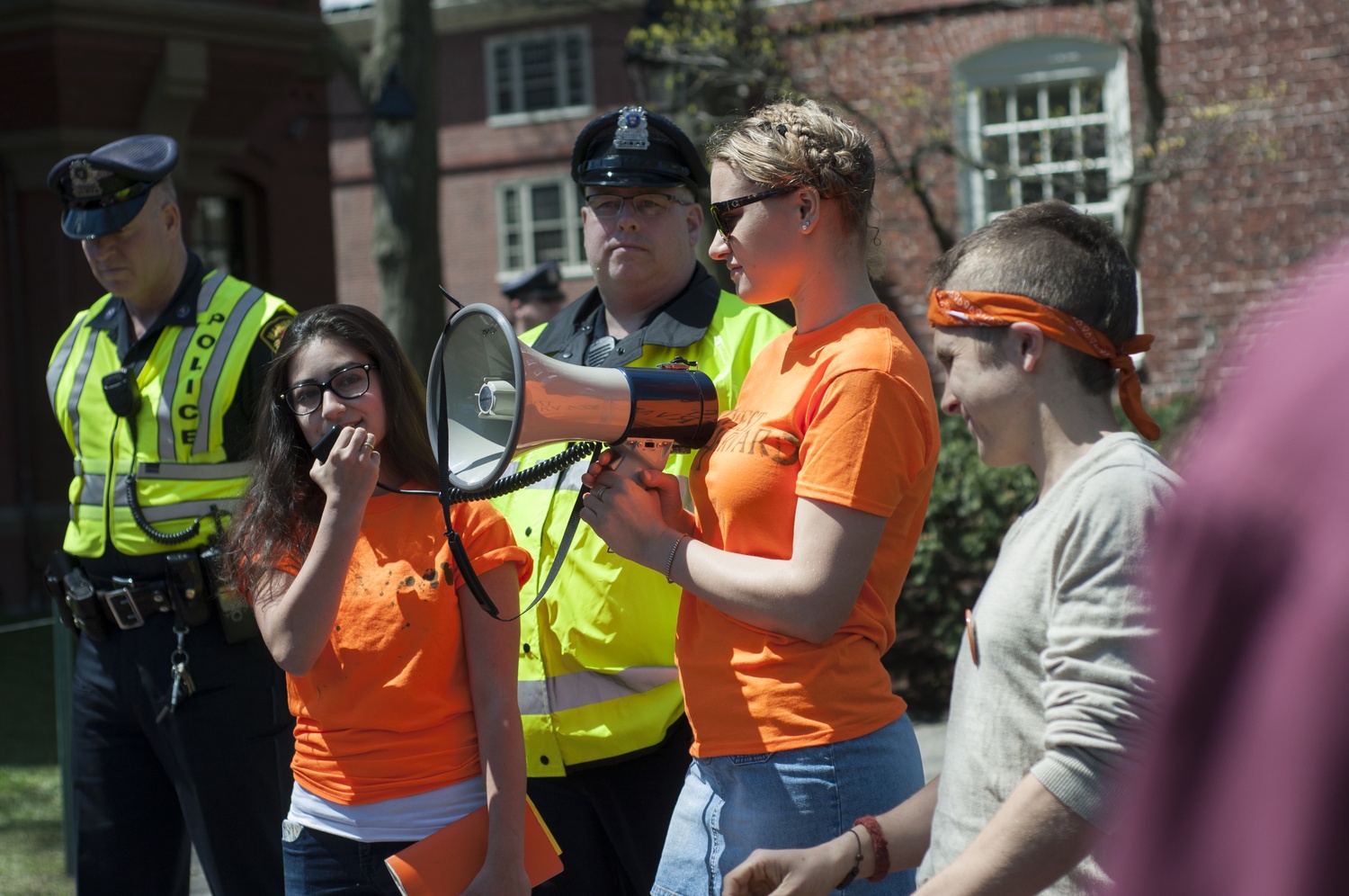 Members of Divest Harvard, including Brett A. Roche '15, far right, who was arrested during a protest Wednesday morning, returned to Massachusetts Hall Friday afternoon to renew their call for an open meeting with the Harvard Corporation.