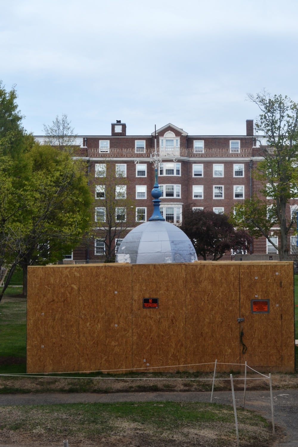 Briggs Hall's Cupola, from Cabot House, sits in the Radcliffe Quadrangle for restoration. The cupola will be host to a time capsule filled with contributions from students, to be opened in 2036.