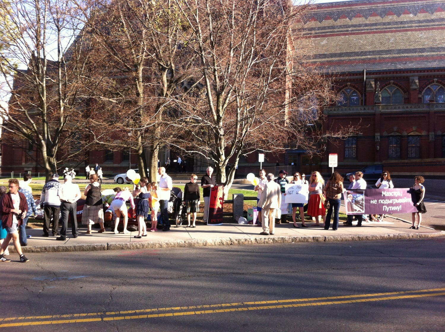 Protesters of violinist Vladimir T. Spivakov stand outside Memorial Hall on Sunday evening, where the Russian violinist was performing.