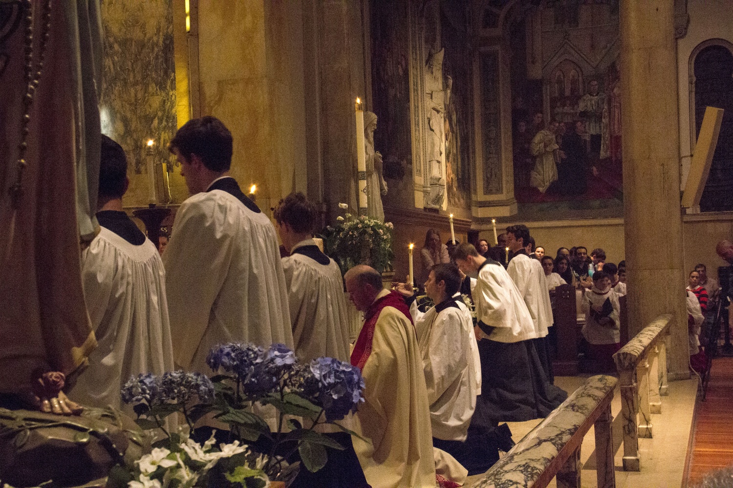 Hundreds gather in St. Paul Catholic Church for a holy hour Monday night in response to a planned reenactment of a Satanic black mass.