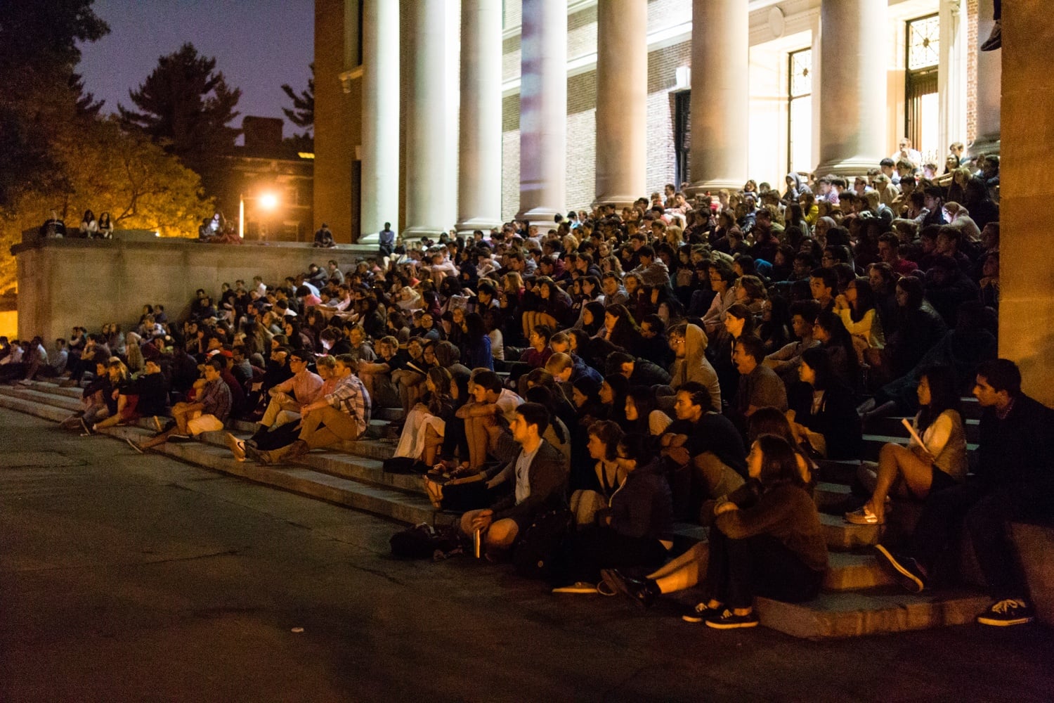 Freshmen gather on the steps of Widener Library to watch the screening of "Legally Blonde," hosted by the College Events Board on Thursday, Aug. 29.