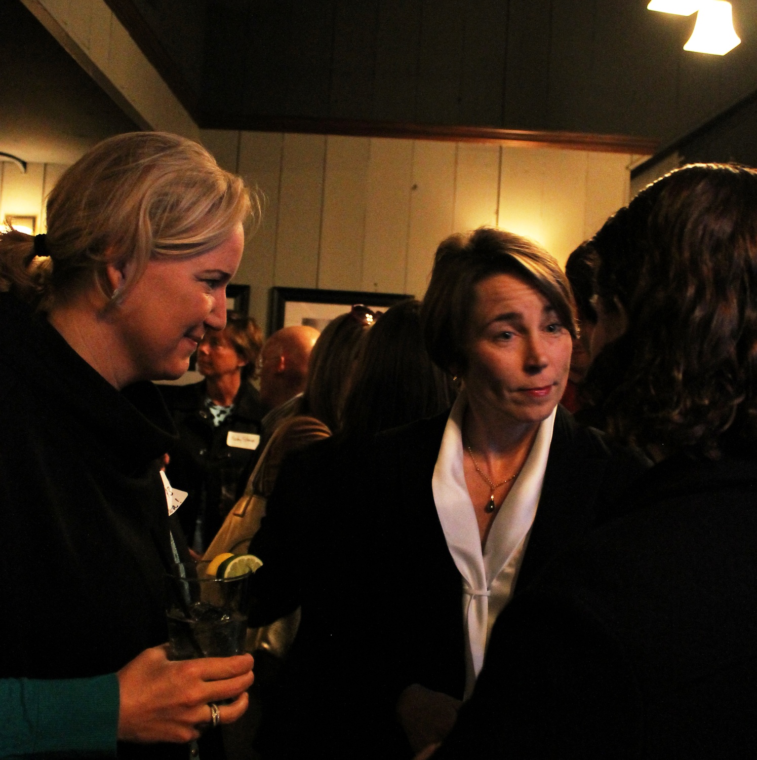 Maura T. Healey '92, Massachusetts Attorney General candidate, converses with supporters at a meet and greet event held in John Harvard's Brewery & Ale House in April.