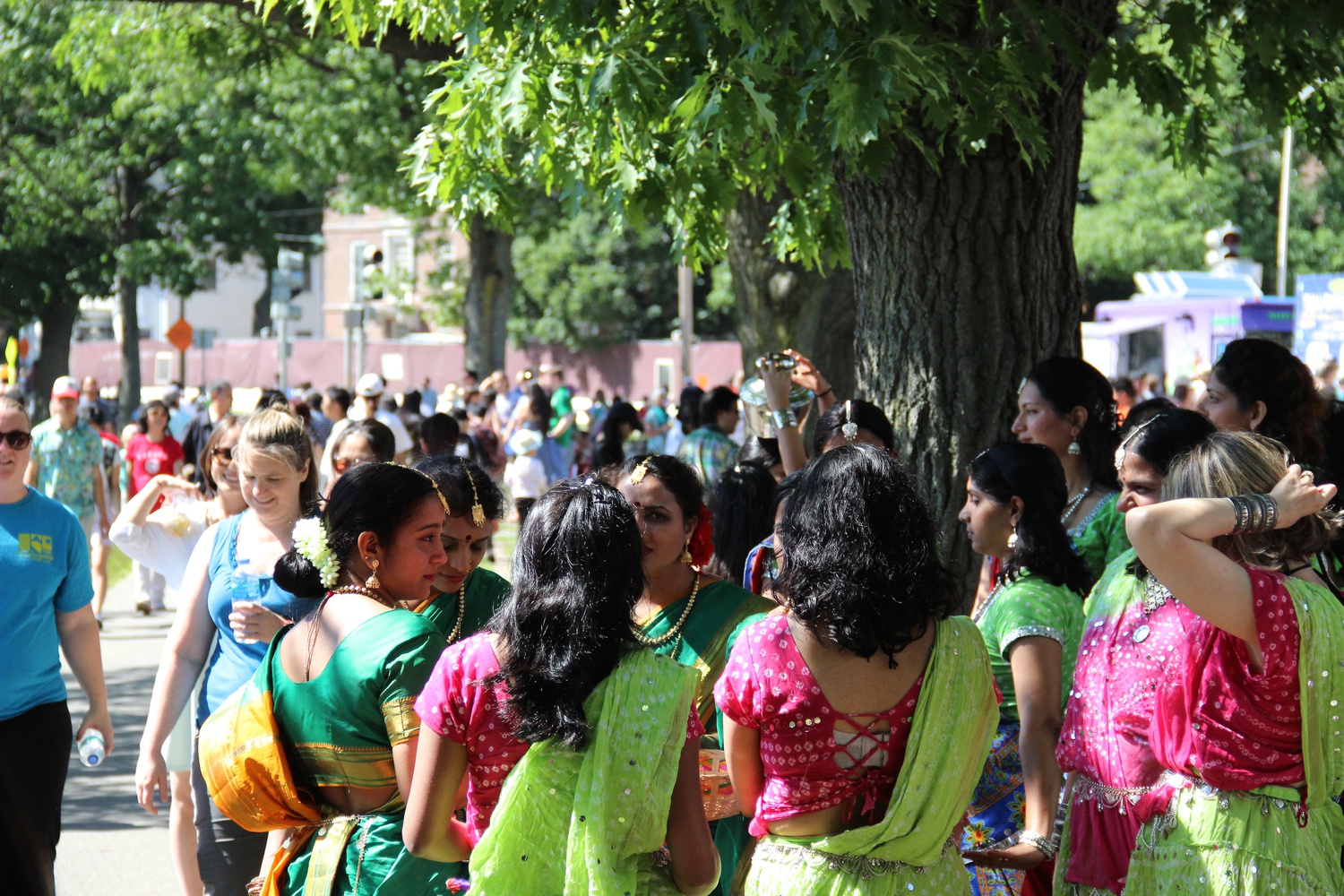 People gather during the annual Boston Dragon Boat Festival on the Charles River in mid-June. The festival included dragon boat races, cultural performances, and aimed to foster friendship among its attendees.