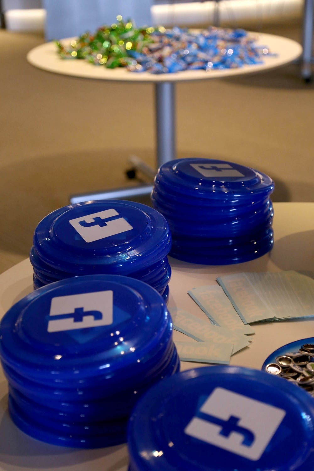 A table full of Facebook paraphernalia rests next to another filled with snacks at CS50 Puzzle Day on September 6, 2014. The Facebook-sponsored event included a photobooth and electronic giveaways.