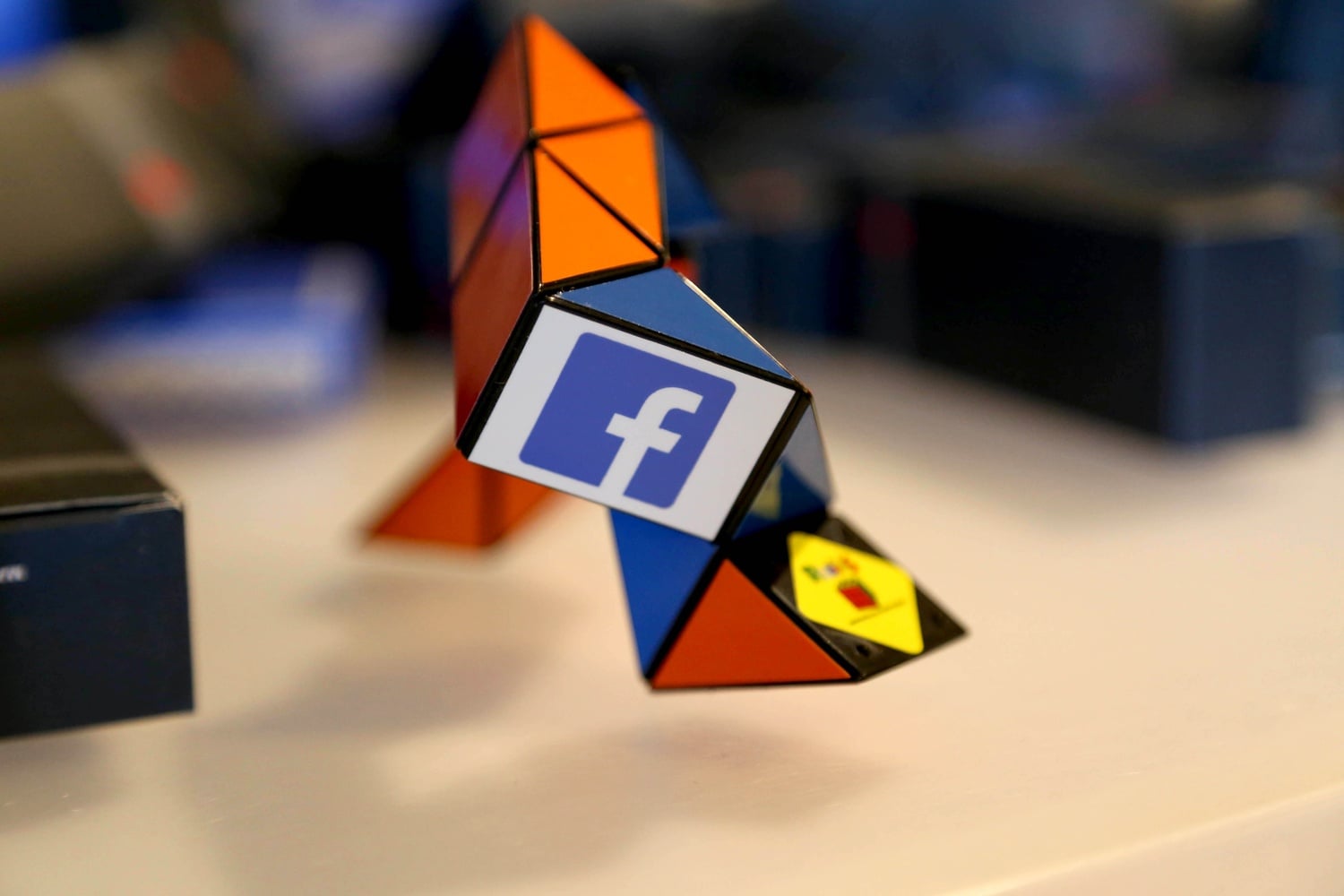 A rubik's snake rests on a table at CS50 Puzzle Day on September 6, 2014. The Facebook-sponsored event featured Facebook and CS50 paraphenalia and giveaways.