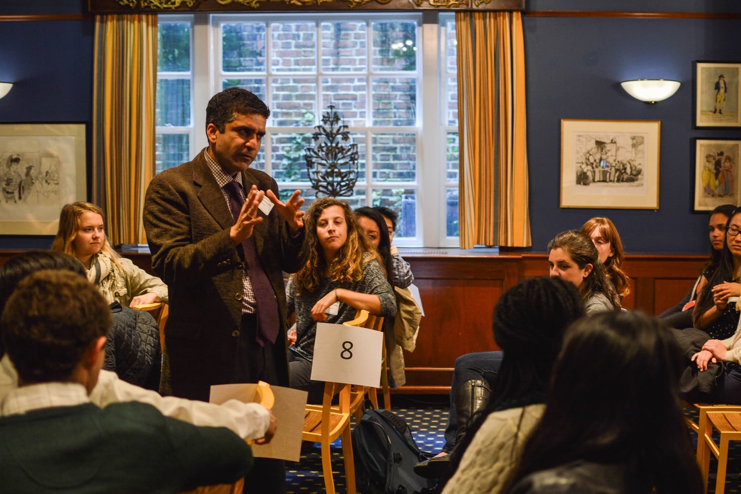Dean Rakesh Khurana addresses students at the Faculty Club on Friday afternoon. The speech was part of a larger reception held for individuals working in public service over the summer.