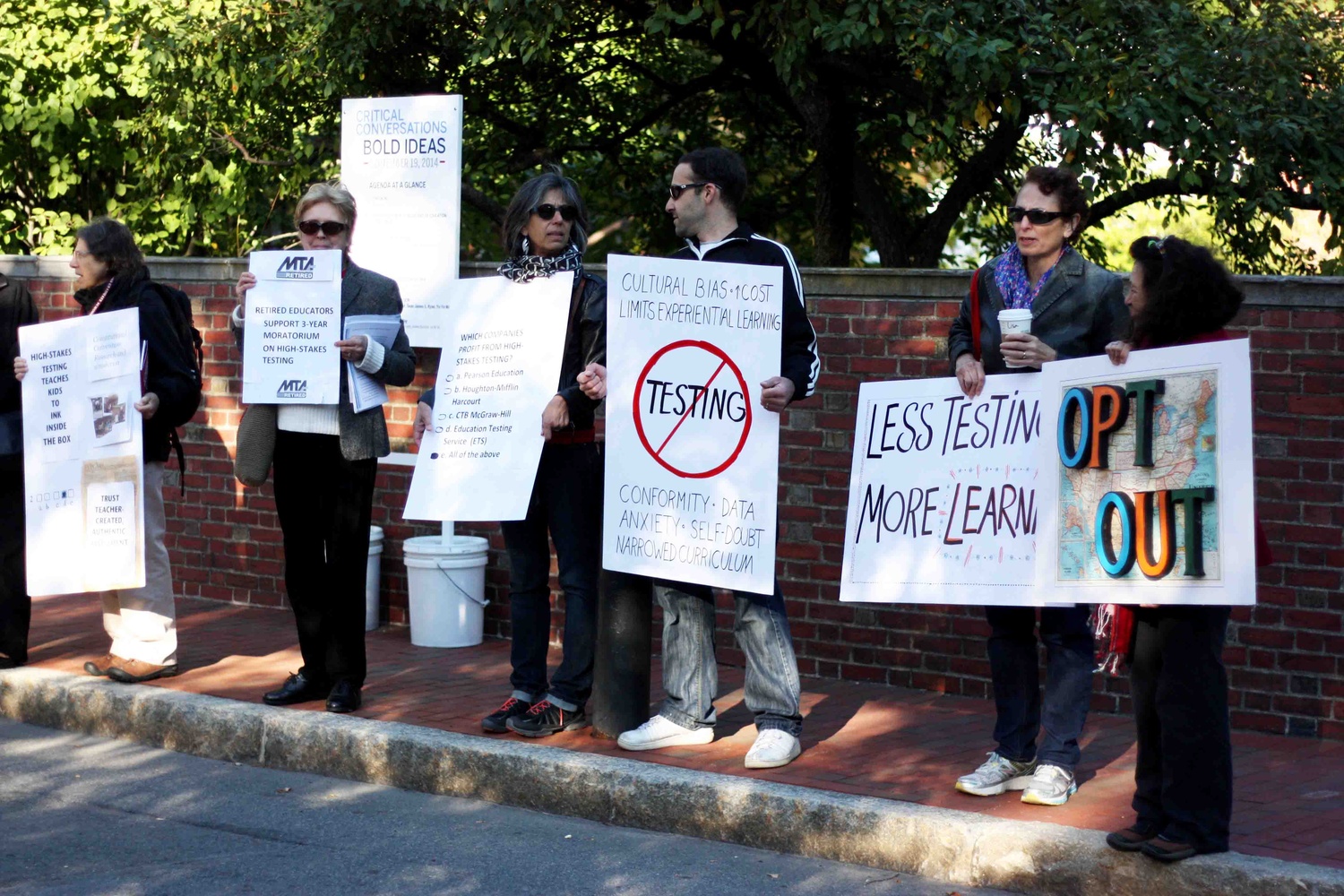 Members of Citizens for Public Schools, the Massachusetts Teachers Association, and other organizations stand outside the Graduate School of Education to protest against U.S. Secretary of Education Arne S. Duncan's policies on high-stakes testing.