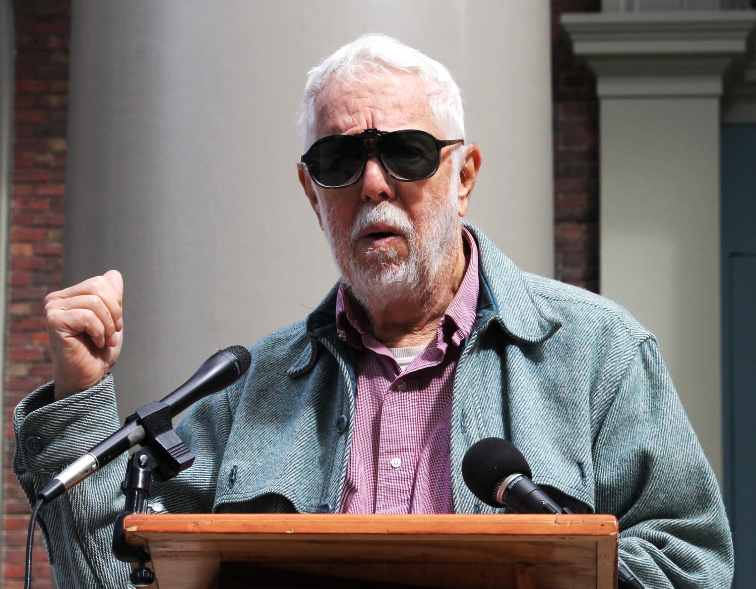 Professor Harvey Cox addresses the media alongside members of the clergy about the casino repeal effort on Monday morning on the steps of Memorial Church. 