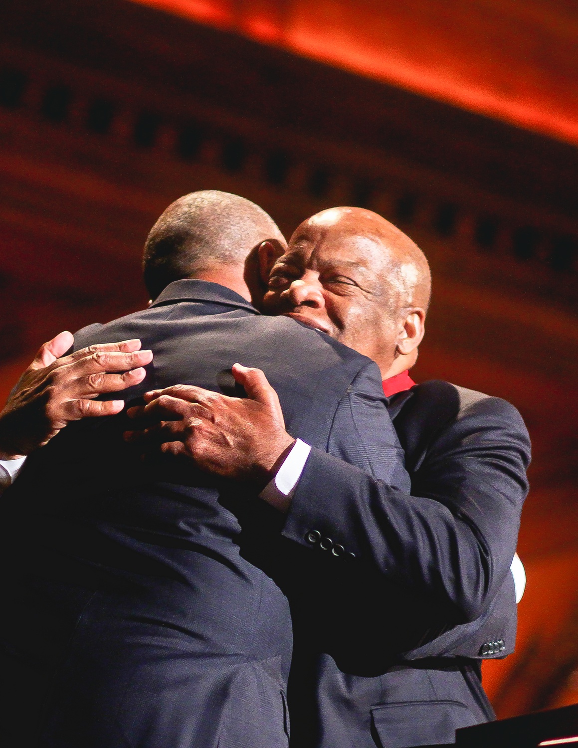 US Representative John Lewis and Governor Deval L. Patrick '78 embrace during the W.E.B. Du Bois ceremony, where Lewis was honored.