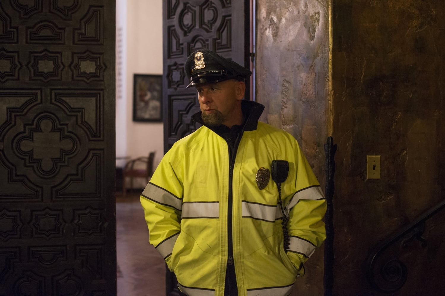 Officer Jabaree of the Harvard University Police Department guards an informal student discussion in the Adams House Lower Common Room on Saturday. After receiving a threatening e-mail, students met to support each other.