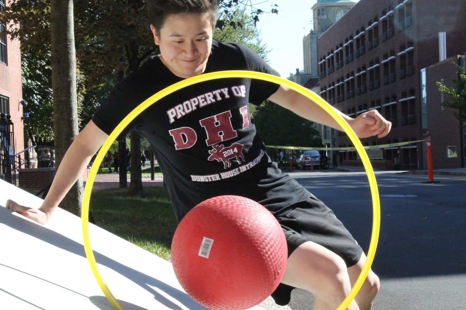 Henry Wang, '15, attempts to score a goal for Dunster House using only his hips.  The Peabody Museum hosted an IM Mesoamerican ballgame for students and visitors Saturday afternoon.