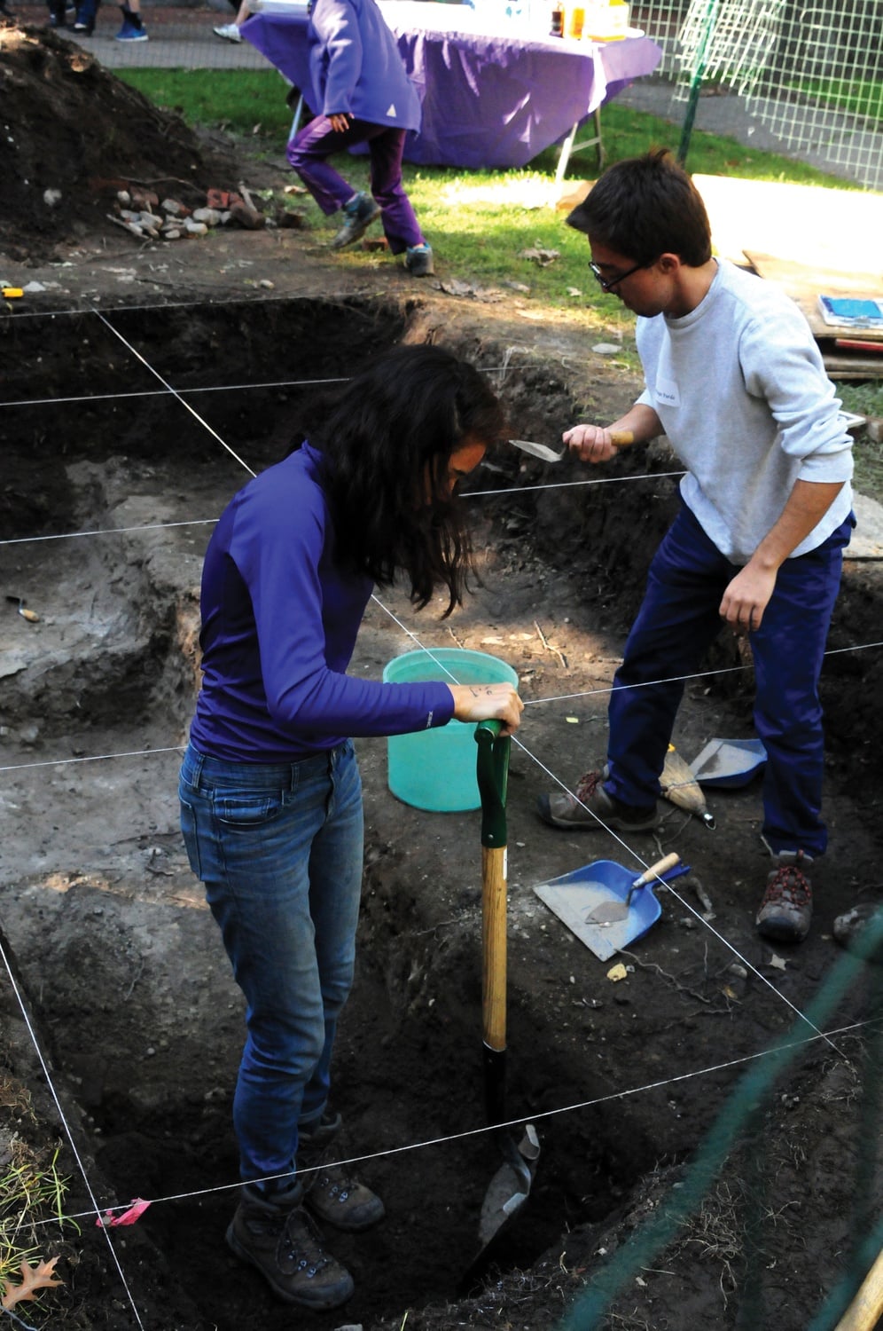 Cristina S. Parajon '18 and Santiago Pardo '16 dig for buried artifacts in Harvard Yard on Sunday, during the archaeology fair hosted by the Peabody Museum and the Semitic Museum.