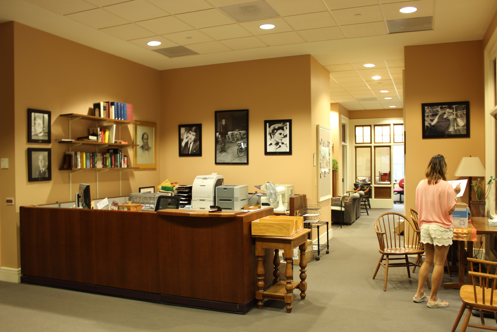 A student stands in one of the reception areas in the English Department, located in the Barker Center, on Wednesday.