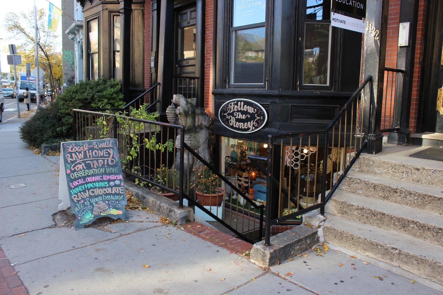 The entrance to Follow the Honey, located a few yards farther down Massachusetts Avenue from Zinneken's, is a set of steps leading down to a hidden doorway.