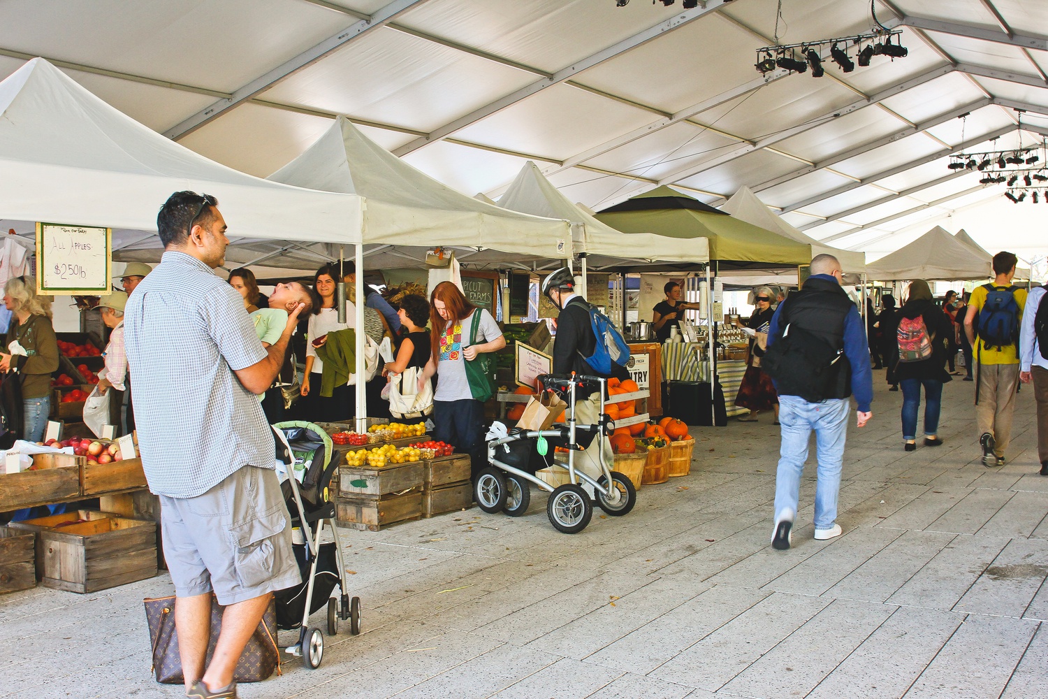 Passerby and shoppers enjoy the weekly Farmer's Market, which was open Tuesday afternoon in the Science Center plaza. The market offered a vast array of fresh, organic products.