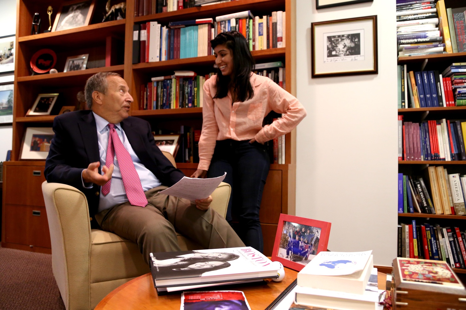 Professor Summers meets with graduate student Natasha R. Sarin in his office. Sarin has worked with Summers on research and as a teaching fellow in his globalization courses.