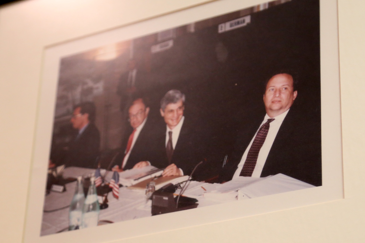 From right, Summers, Robert E. Rubin '60, and Alan Greenspan sit together in a photograph that hangs in Summers' Kennedy School office.
