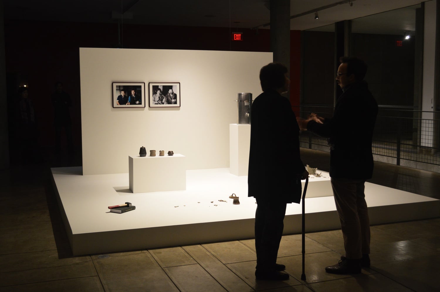 Visitors contemplate the provoking work "Rehearsal for a Reunion (with the father of pottery)" by Simon Fujiwara now on display at The Carpenter Center.