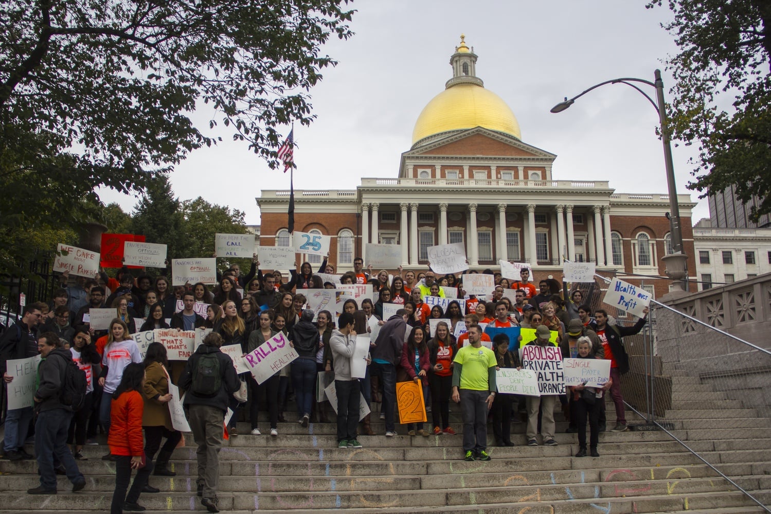 Protesters gather in front of the Massachusetts State House to advocate for single-payer healthcare in the state.