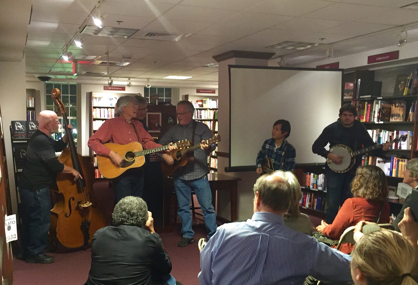 John B. Cooke, center-left, rock star Janis L. Joplin's road manager between 1967 until her demise, performs with the Charles River Valley Boys at the Harvard Coop. After the performance, Cooke signed copies of his book "On the Road with Janis Joplin".