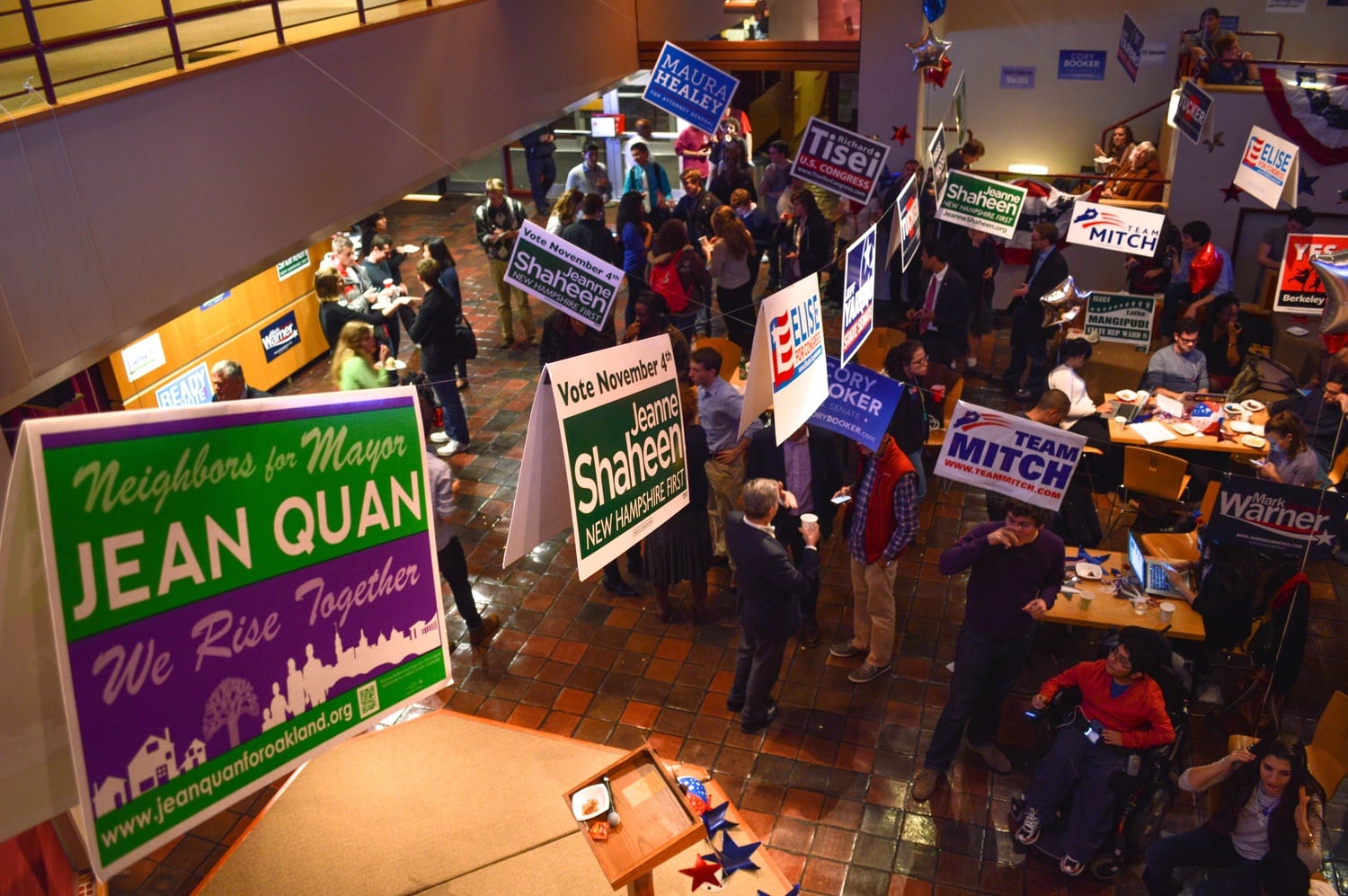 Under campaign banners and helium balloons, students and non-students alike congregate at the Institute of Politics in anticipation of the 2014 election results. 