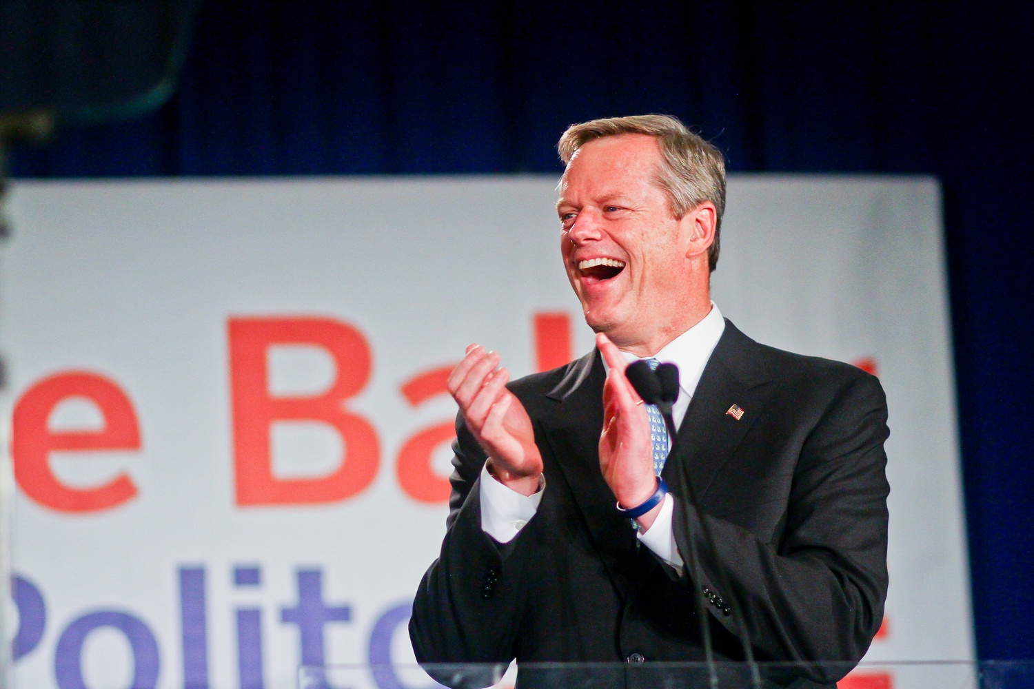 Charles D. Baker '79 celebrates after narrowly winning the Massachusetts gubernatorial election early Wednesday morning. The race fluctuated between the two candidates throughout the night, at one point with vote differences in the mere hundreds. 