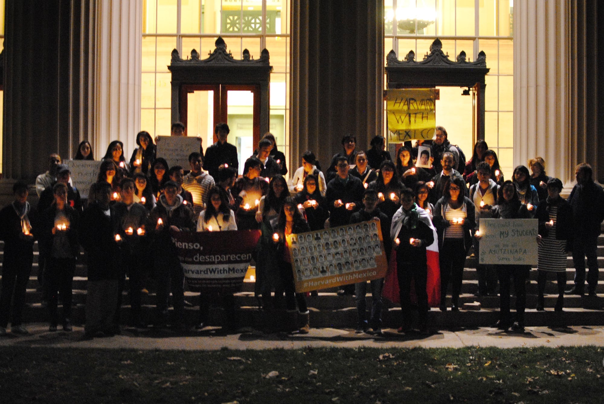 College students from schools throughout the greater Boston area gather in Killian Court at MIT Wednesday evening to peacefully protest against the kidnapping of 43 students, six of whom have been found dead, from the Ayotzinapa Normal School in Mexico. The group condemned the government's failure to address the situation. In solidarity, they lit 43 and walked from MIT to the Mexican Consulate. 