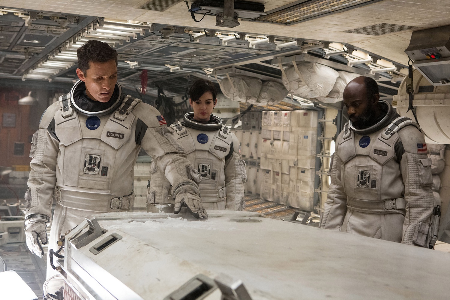 Characters played by Matthew McConaughey, Anne Hathaway, and David Gyasi explore a scientific station on a faraway exoplanet in "Interstellar."