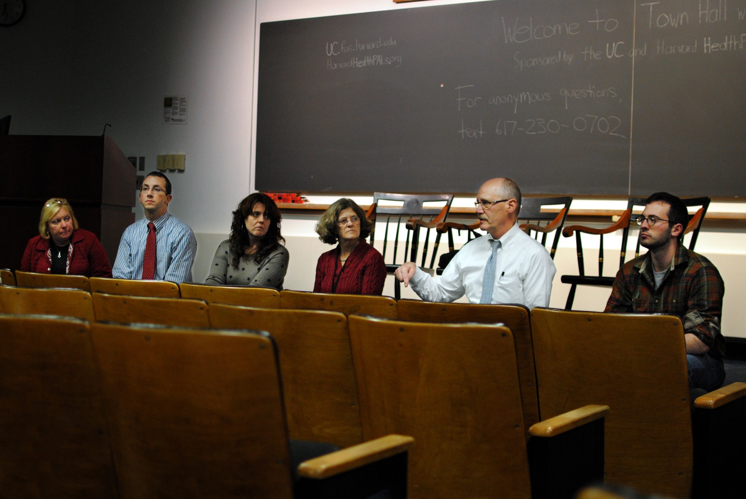 Director of Harvard University Health Services, Dr. Paul Barreira, second from left, answers a student's question at HUHS's second Town Hall meeting this week. The meeting on Wednesday evening in Emerson Hall gave students the opportunity to join in a discussion about proposed changes to HUHS.