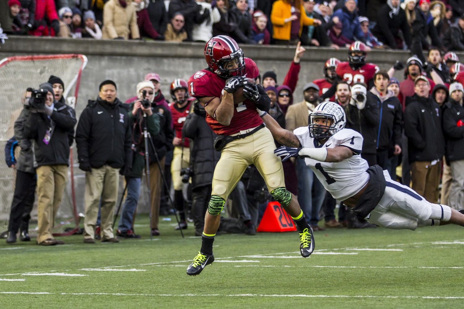 Crimson wide receiver Andrew Fischer catches the game-winning score against Yale at The Game, played in Cambridge, last year.