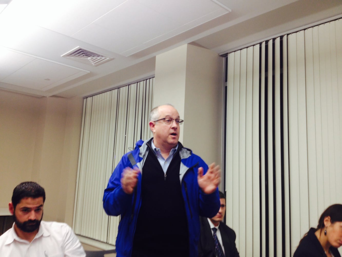 Robert Eckert, a manager from Suffolk Construction speaks about construction mitigation at a Harvard-Allston Task Force meeting on Monday.