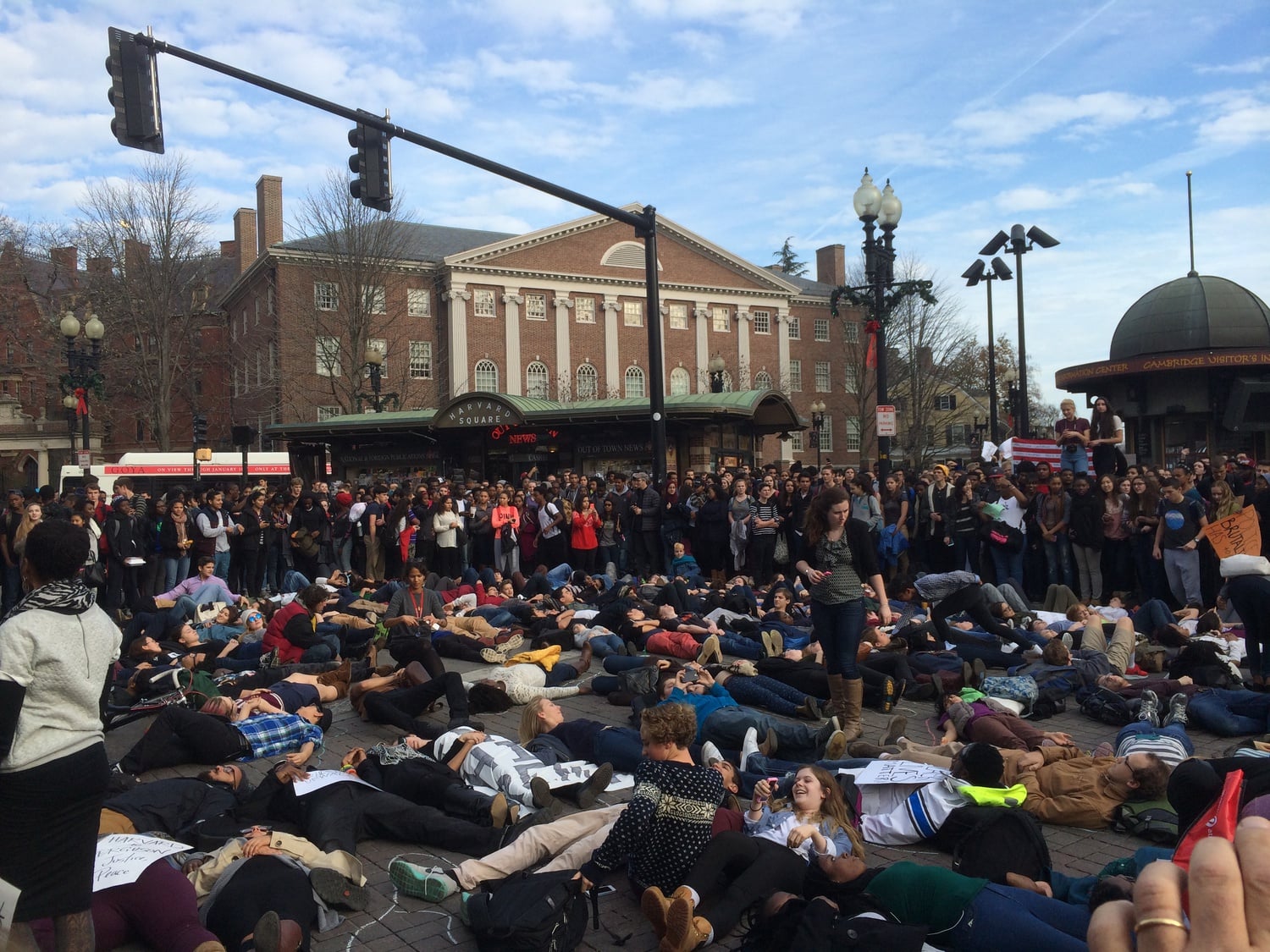 Dozens of students lie in the middle of Harvard Square in a "die-in" in memory of Michael Brown, a black Missouri teenager shot and killed by a white police officer in August.