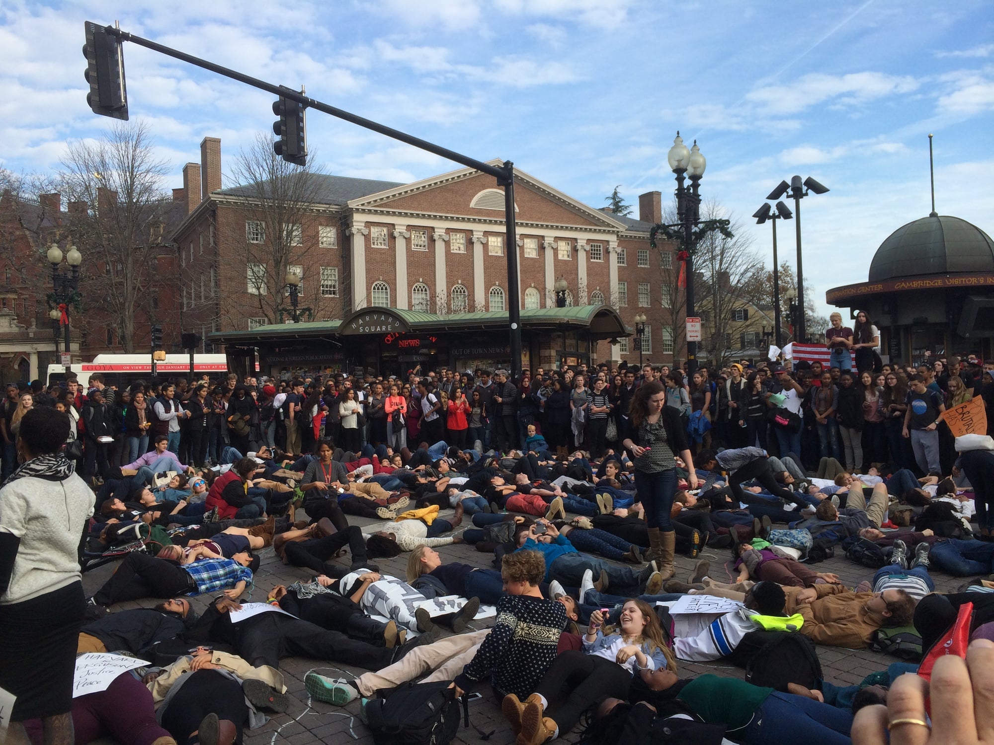 Dozens of students lie in the middle of Harvard Square in a "die-in" in memory of Michael Brown, a black Missouri teenager shot and killed by a white police officer in August.