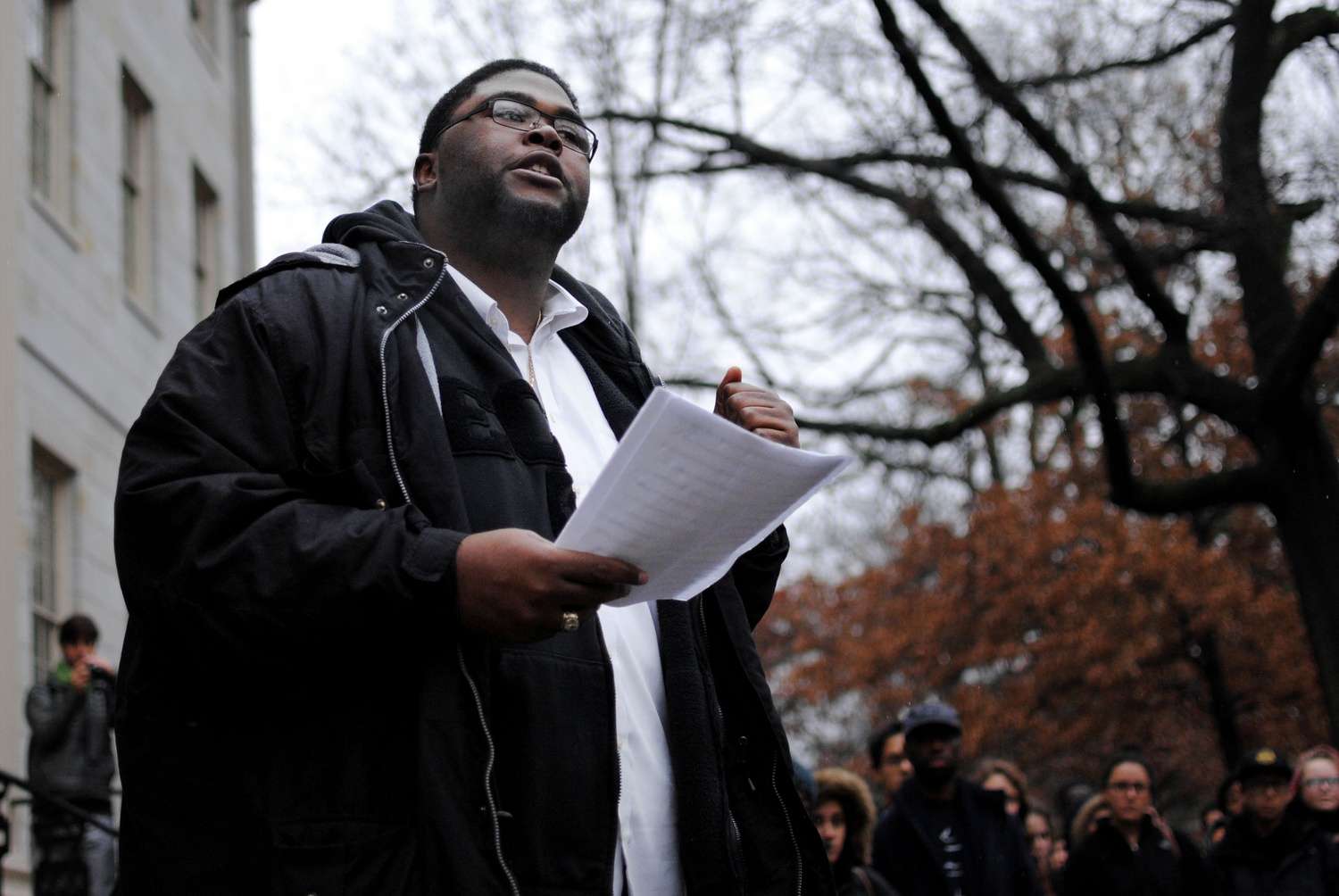 Mather House tutor Anthony Jack gives a speech at a protest Wednesday morning outside University Hall, stirred by the decision to not indict police officer Darren Wilson for the killing of a black, unarmed teenager, Michael Brown. 