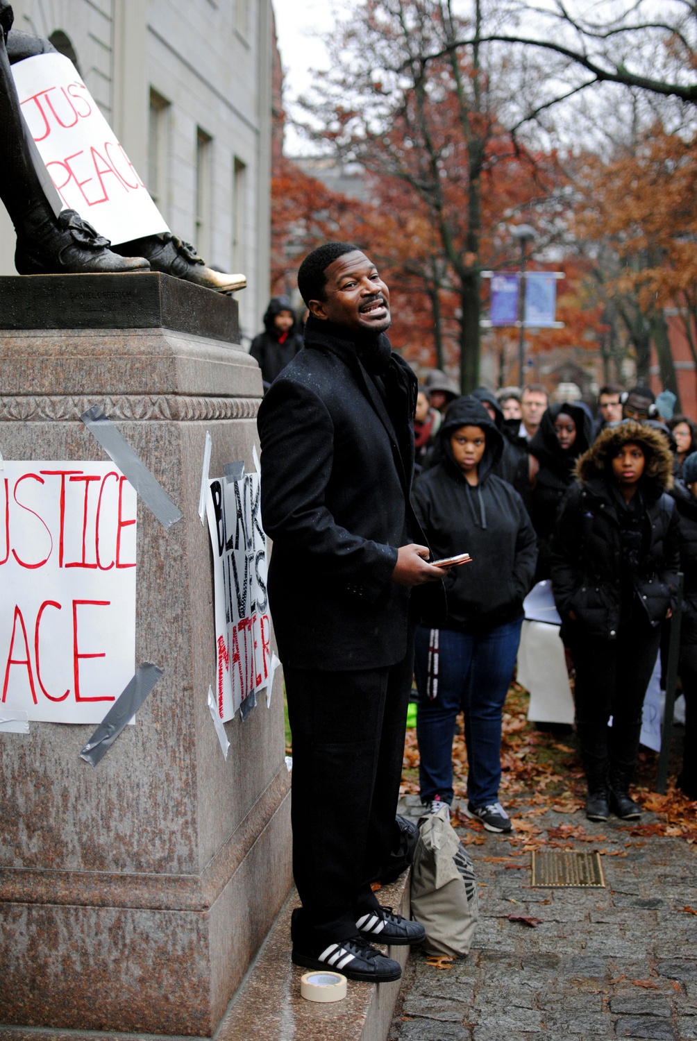 Professor Jonathan L. Walton, Plummer Professor of Christian Morals and Pusey Minister of Memorial Church echoes Martin Luther King Jr., saying, "injustice anywhere is a threat to justice everywhere" at a protest Wednesday morning outside University Hall.