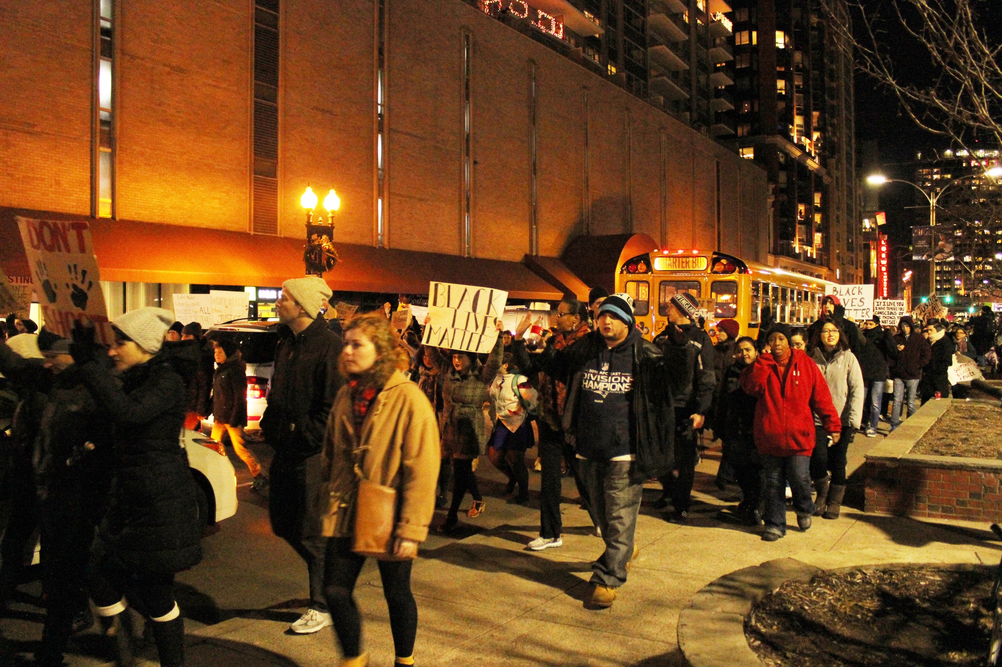 Protestors stop traffic as they march on Tremont Street.
