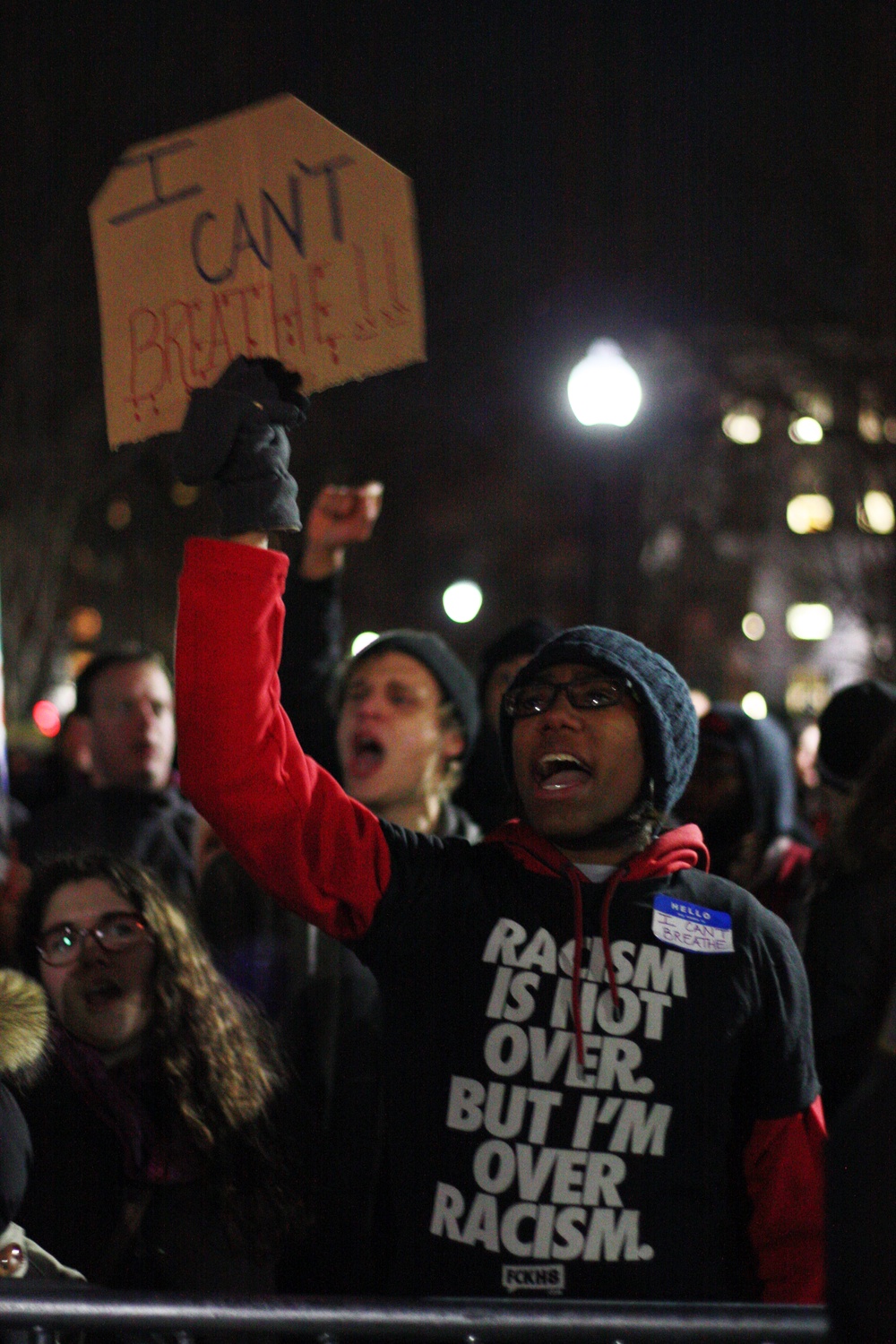 A protestor holds up his sign in Boston Common.