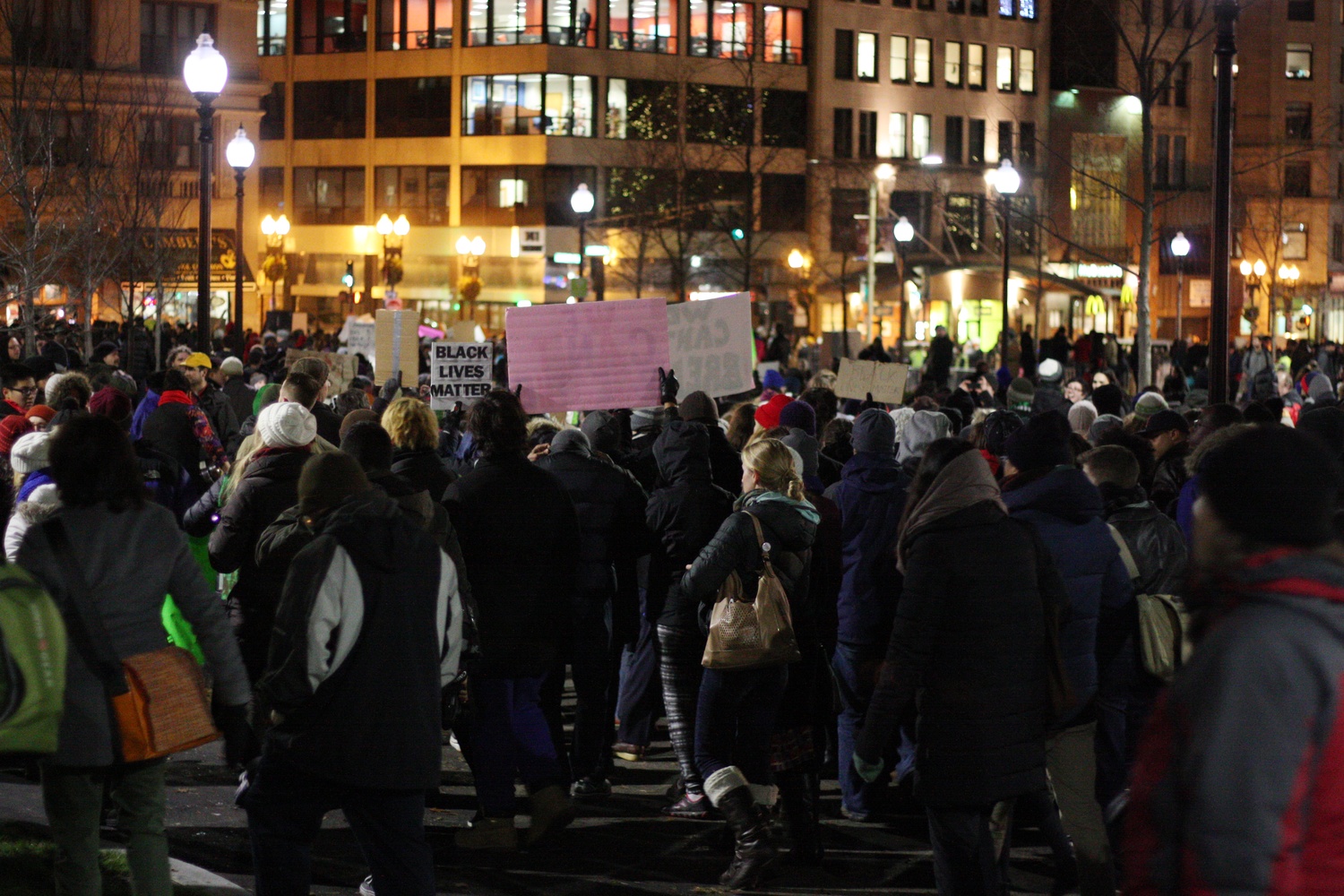 Protestors pour out of Boston Common after the tree lighting ceremony. The crowd later gathered at City Hall Plaza and the Zakim Bridge.