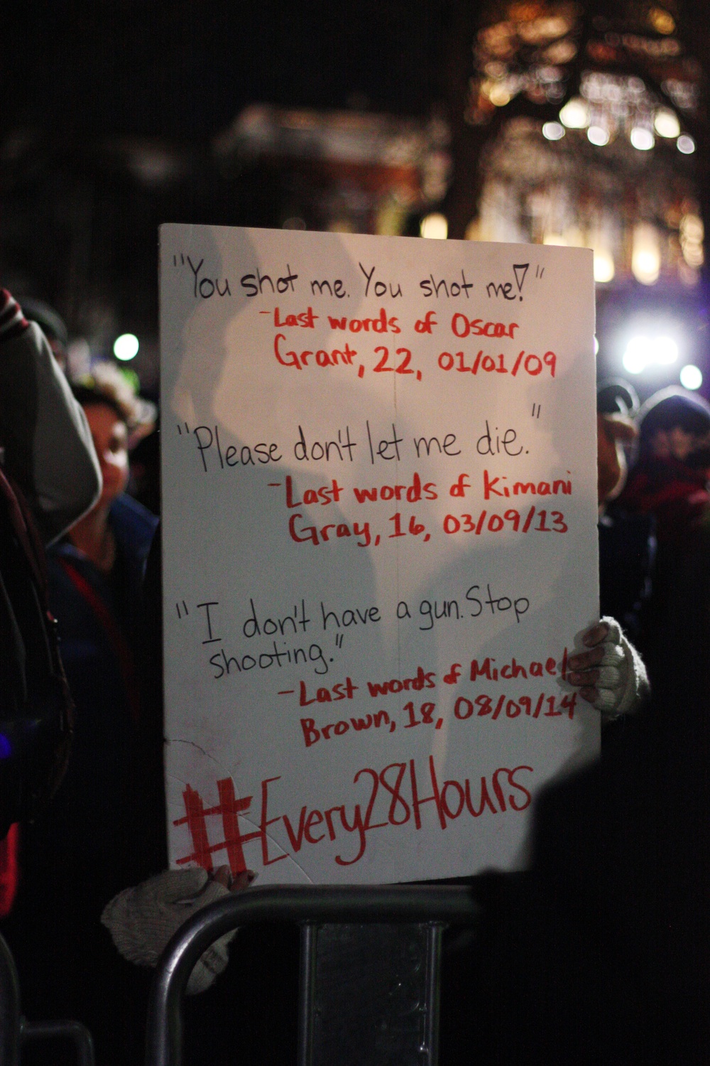 A protestor holds up her sign.
