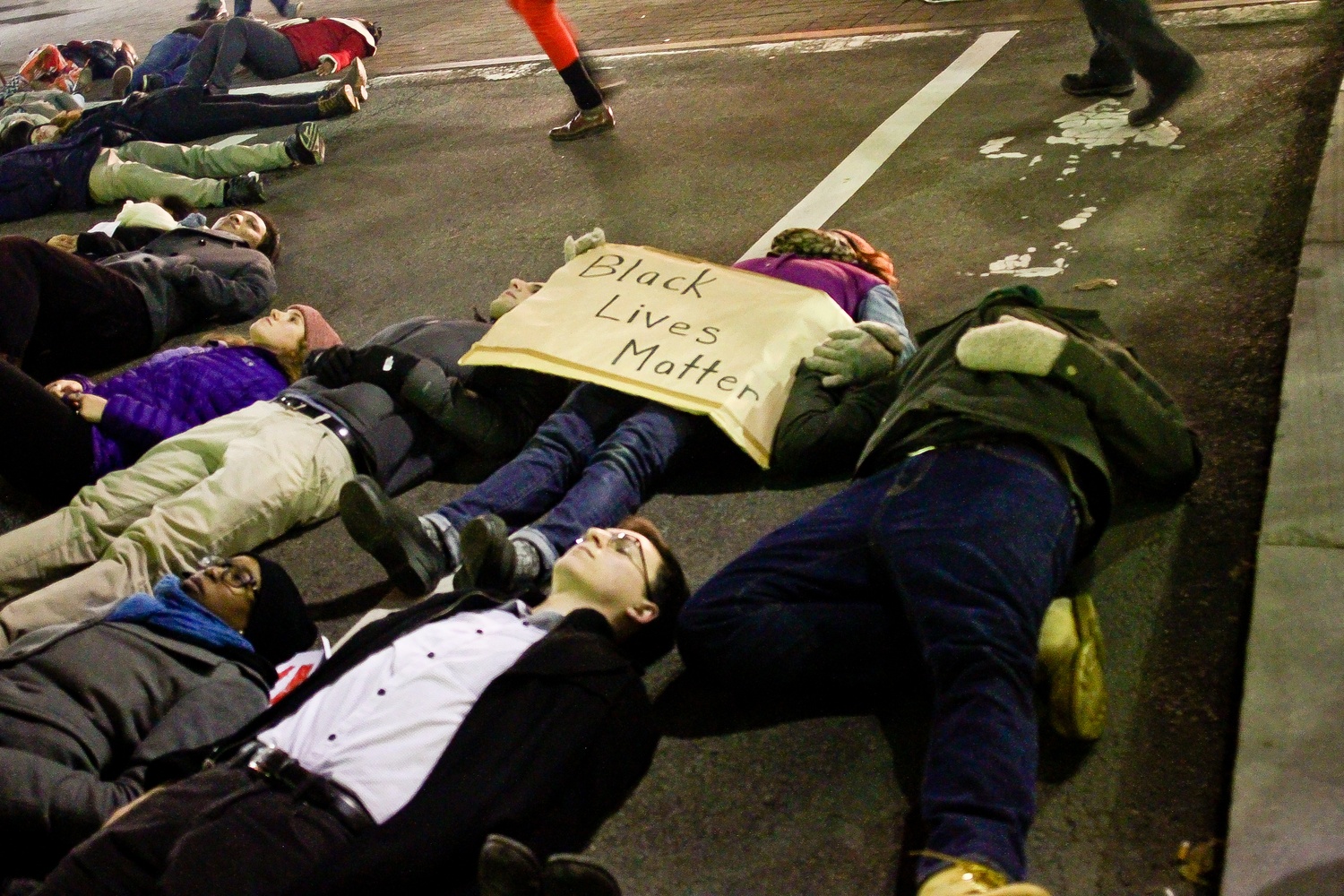 A protestor at the die-in in Harvard Square on Friday evening.
