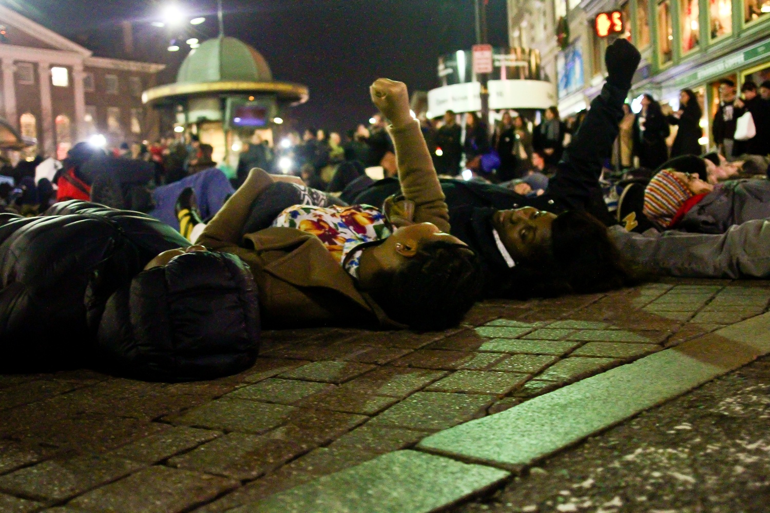 Protestors at the die-in in Harvard Square on Friday evening.