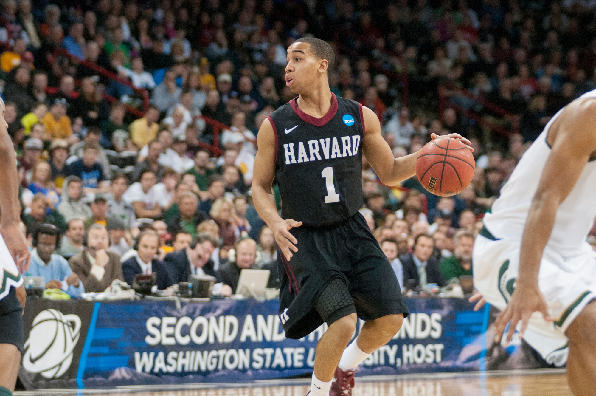 Junior co-captain Siyani Chambers had 10 points and seven assists Monday as the Harvard Crimson won its sixth straight home game to open the 2014 season.