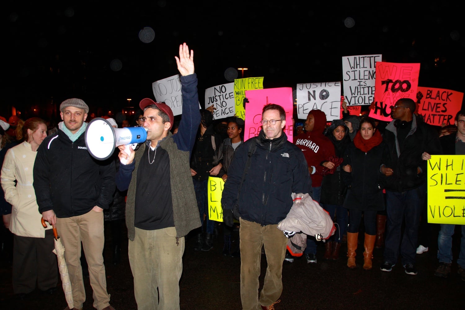 Dean of College Rakesh Khurana speaks on behalf of protesters during Primal Scream early Thursday in Harvard Yard. Dean of Student Life Stephen Lassonde stands at his side.
